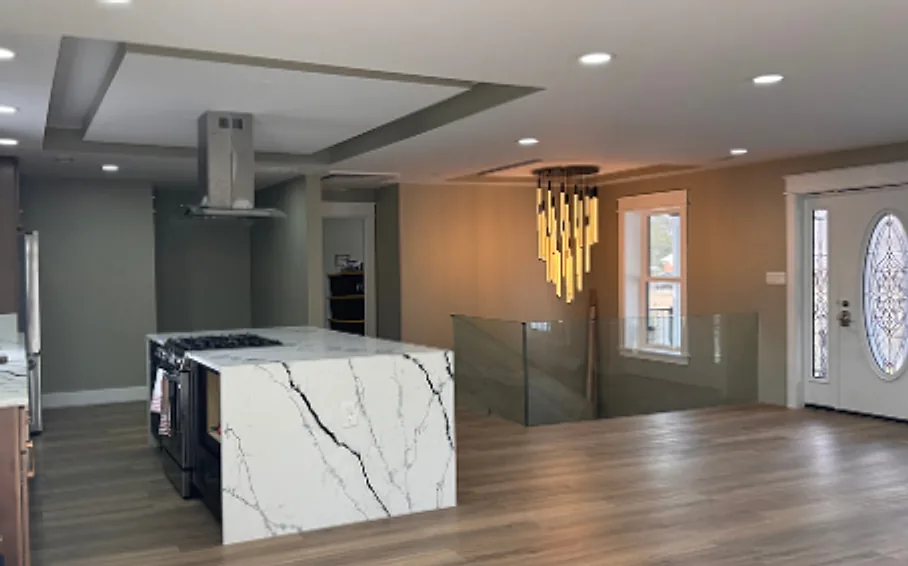 Home interior after the renovation: new kitchen island, lighting and flooring