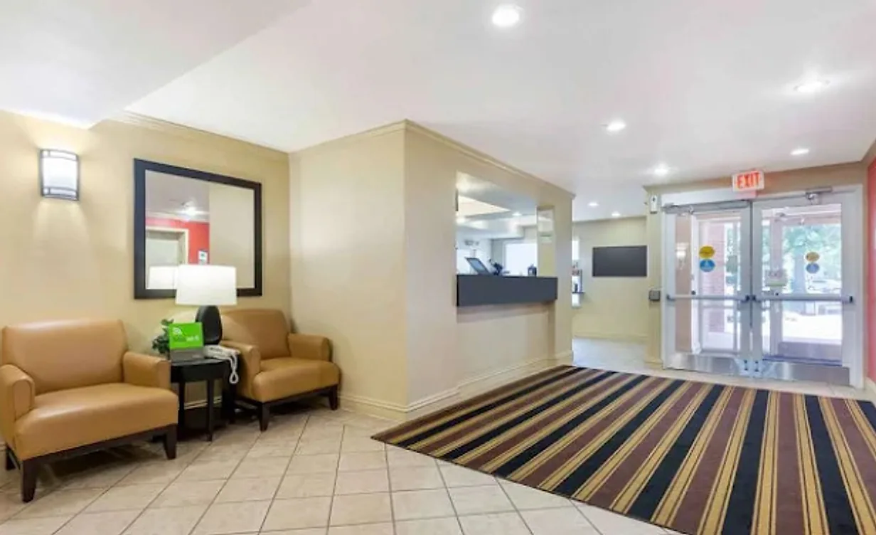 Hotel lobby before the renovation: tile floor and striped carpet